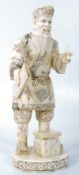 An ox bone carved Japanese scholar figurine. 21cm tall.