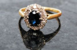 A good ladies sapphire and diamond 18ct yellow gold and platinum ring. The gold hoop having large