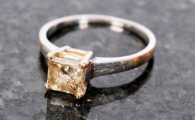 An 18ct yellow gold single stone princess cut ring, stone approx .75 carat, marked 750. The plain