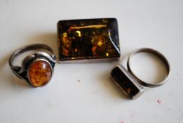 An early 20th century Amber and white metal silver stamped 925 cocktail ring with amber cabochon