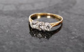 A good ladies 3 stone diamond 18ct and platinum yellow gold ring. The plain hoop with inset 3