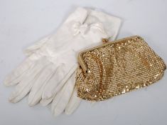 A mid 20th century ladies gold coloured purse / evening bag, with inset stones to clasp. Along with