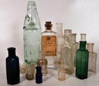 A collection of vintage glass bottles to include hand blown, mineral bottles etc