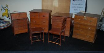 A good collection of vintage oversized dolls house furniture to include chests of drawers, chairs,