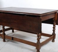 A Victorian large solid oak refectory barley twist drop leaf dining table. The heavy and thick
