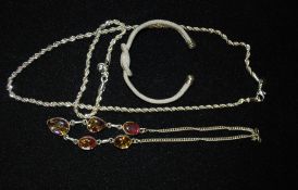 A large twist design white silver necklace stamped 925, along with a similar design bracelet also