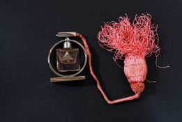 A 1930`s perfume bottle with pink tassle, in original box along with two other vintage small