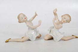 A pair of porcelain German ballerina figurines marked to base. 10cm high.