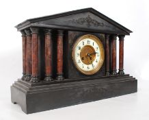 A Victorian large slate and marble mantle clock having enamel face with glass front flanked by