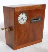 Gledhill huddersfield time recorder having encased movement in mahogany case having decorative key