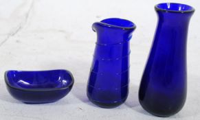 2 late 20th century Bristol Blue glass posy vases, one with swirl decoration together with a pin