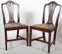 2 Edwardian mahogany Chippendale revival dining chairs. Squared legs with stretchers supporting drop