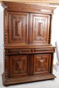 A 19th century French walnut buffet / bookcase cabinet. The geometric relief detailed cupboard doors