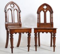 2 Victorian eclesiastical solid oak hall chairs. Turned legs with panel seats beneath arched