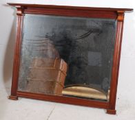 A large Victorian style mahogany overmantle mirror. The mahogany frame having reeded column sides