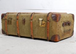 A 19th century canvas and wooden bound steamer trunk / coffee table. Green with wooden strapping,