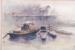 Chinese watercolour riverscape and boat scene. Signed to lower corner being framed and glazed.