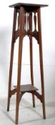 An Edwardian Arts & Crafts solid oak tall plant stand / torchere. The squared sides tapering upwards