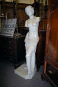 A large female statue constructed of resin to replicate marble. Decorative square plinth base with