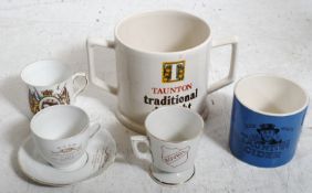 A small collection of collectable china cups to include a Taunton tradional draught cider mug