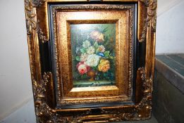 An oil on board of still life flowers, signed the bottom right with an indistinct signature (C.
