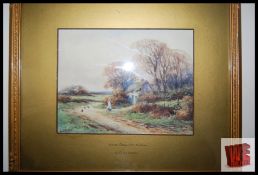 An early 20th century watercolour of a country landscape with girl and thatched cottage, signed