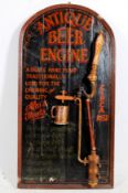 A large decorative pub sign 'Antique beer' complete with a vintage beer pump having working
