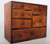 A 19th century Victorian walnut desk tidy having marquetry inlaid drawer fronts.