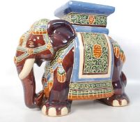 A large decorative Chinese china Elephant stool. Decorative colourful design with square platform