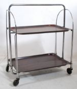 A 1950's Dinette metamorphic buffet trolley, bakelite and chrome. Made West Germany.