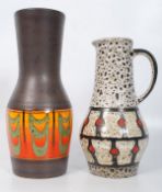 Two German pots, one being a Dumbler & Breisen (30cms Tall). The other, A ewer standing at 25cms