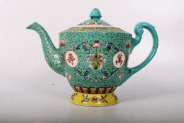 A Chinese famille blue large teapot having lid to top, bulbous centre with all over floral spray