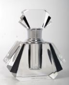 An Art Deco style glass perfume bottle, with angular construction and stopper. 8cm tall.