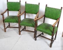 A set of 4 (3 showing) good oak jacobean revival green leather upholstered carver armchairs (
