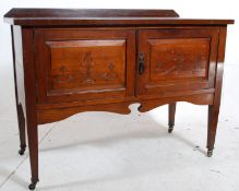 An Edwardian Art Nouveau oak washstand cabinet. Square tapered legs with double door cupboard above.
