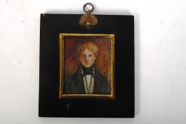 A Victorian miniature oil on ivory portrait of a figure in a black ebonised frame. 13cm x 12cm.