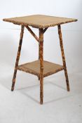 A Victorian bamboo occasional table having 2 rattan weave tiers to each. 67cms HIgh x 46cms