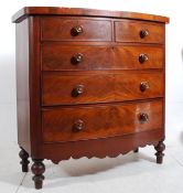 A Victorian flame mahogany 2 over 3 chest of drawers. Standing on bun feet the chest has knob