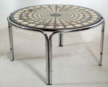 A 1970's retro chrome and mosaic fat lava style coffee table. The chome legs supporting the circular