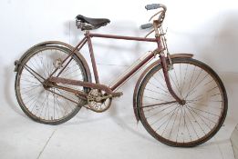 An early 20th century Triumph bicycle. Barn find condition however good Triumph chainset