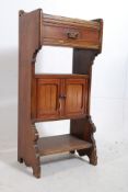 A Victorian mahogany hall cabinet. The shaped supports having a lower tier with central cupboard