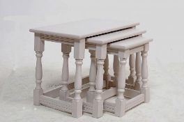 A 1920's shabby chic painted nest of graduating occastional tables. All with turned legs united by