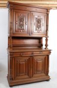 A 19th century French walnut buffet / bookcase cabinet. The geometric detailed cupboard doors to