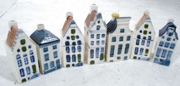 A collection of 6 decorative china KLM Bols Dutch Delft cottage buildings. 13cm tall.
