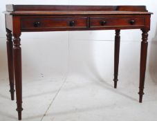 A good Victorian solid mahogany writing table desk. The turned legs supporting a fitted frieze