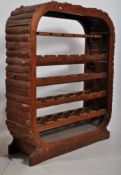 A decorative Art Deco style wooden large open fronted wine rack. Good shaped sides and arched feet