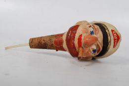 A vintage bar bottle stop pourer in the form of a sea captain by Kinki-Bee 'Made In England.' Once