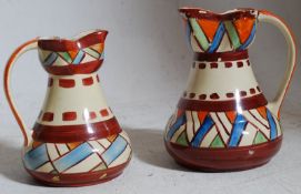 A pair of (2) Wadeheath handpainted 1930's Art Deco jusgs having geometric design with waisted necks