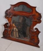 A good Victorian mahogany overmantle mirror having an inset bevelled edge mirror glass in a