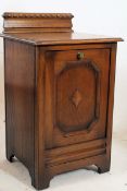 1920's carved oak jacobean revival coal purdonium. Geometric lined front with inset liner. 71cms